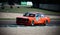 BMW 320i vintage car racing on track old fashioned motor sport