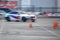 BMW M3 E90 Race Car riding on high speed on drift track in blurred motion. Drift And Car Show competition on