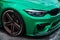 BMW M3 F80 Sport Car wrapped in green vinyl wrap equipped with AC Schnitzer wheels with low profile tires on