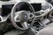 BMW X5 steering wheel and dashboard. Black leather interior of the SUV.