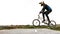 Bmx biker performs a stunt on his bicycle