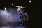 Bmx cyclist performing stunt