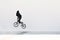 BMX freestyle. Young BMX bicycle makes tricks on the white background