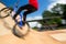 Bmx rider jumping over on a U ramp in a skatepark