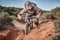 BMX Rider Kicking Up Dirt on Trail - Close-up Action Shot of Adrenaline-Fueled Trick on Dirt Trail