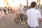 bmx riders at skate park at sunset background. Background with cyclists on bmx