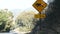 Boar or pig crossing yellow traffic road sign, California USA. Wild animal xing.