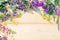 Board background for design in a frame of the blossoming summer flowers. The place for an inscription. Light background