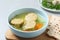 Board with bowl of Jewish matzoh balls soup