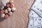 Board game lotto. Cards for the game of lotto in front of them wooden barrels spilled out of the bag. Wooden background.