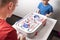 Board games: Father and children play table hockey