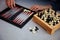 Board games on the table. Chess, backgammon, checkers. Boards are laid out for the game. Play, have fun at home. Leisure, hobbies