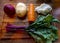 Board with ingredients for preparing tasty borscht on white background