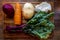 Board with ingredients for preparing tasty borscht on white background