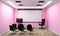 Board room - empty office concept , business interior with chairs and plants and wooden floor on pink wall empty. 3D rendering