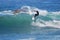 Board surfer riding in a wave at Laguna Beach, CA.
