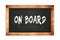 ON  BOARD text written on wooden frame school blackboard