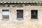 Boarded up windows of abandoned house. old decay building facade