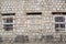 Boarded-up Windows in an old stone building