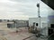 Boarding Bridge on the tarmac of an airport. Jet aircraft docked at the gate.