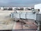 Boarding Bridge on the tarmac of an airport. Jet aircraft docked at the gate.