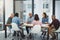 In the boardroom, all ideas are welcomed. Full length shot of a group of businesspeople sitting in the boardroom during