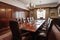 boardroom with long wooden table and leather chairs for formal meetings