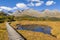 Boardwalk across alpine lake at Key Summit Track in Fiordland National Park, New Zealand