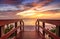 Boardwalk leading to a Sunset over North Gulf Shore Beach