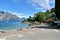 Boardwalk near Lake Garda, pier, green trees and bushes