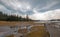 Boardwalk next to Tangled Creek and Black Warrior Springs leading into Hot Lake in Yellowstone National park in Wyoming USA