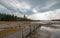 Boardwalk next to Tangled Creek and Black Warrior Springs leading into Hot Lake in Yellowstone National park in Wyoming USA