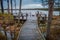 Boardwalk path leads to wooden observation deck with benches and swimming place.