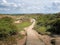 Boardwalk path through sand dunes near Crow Point, North Devon, UK.