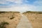 Boardwalk Path To A Sunny Sandy Beach