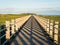 Boardwalk, perspective with vanishing point leading lines and shadow pattern