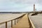 Boardwalk in Praia Barra with lighthouse