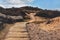 Boardwalk through the sand dunes to a quiet sandy beach