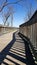 Boardwalk with shadows on sunny day