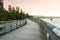 Boardwalk on the shore of a beautiful bay at sunset