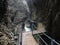 Boardwalk in wet gorge, narrow passage