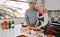 She boasts the best roast. Shot of a mature couple preparing a Thanksgiving meal at home.