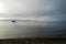 Boat anchored offshore at Spencer Spit State Park on Lopez Island, Washington, USA