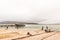 Boat anchored at pier and anglers at Langebaan