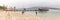 Boat anchored at pier and anglers at Langebaan