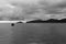 Boat Anchored South China Sea Distant Island Dark Sky Monochrome