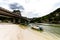 Boat anrchored underneath bridge in the point where the sea meets the Marapendi Lagoon, in Barra da Tijuca, Rio de