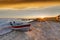 Boat on Beach at Sunrise Over Buffalo Lake, Alberta