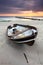 Boat on beautiful beach in sunrise