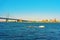 Boat at Benjamin Franklin Bridge over Delaware River in Philadelphia